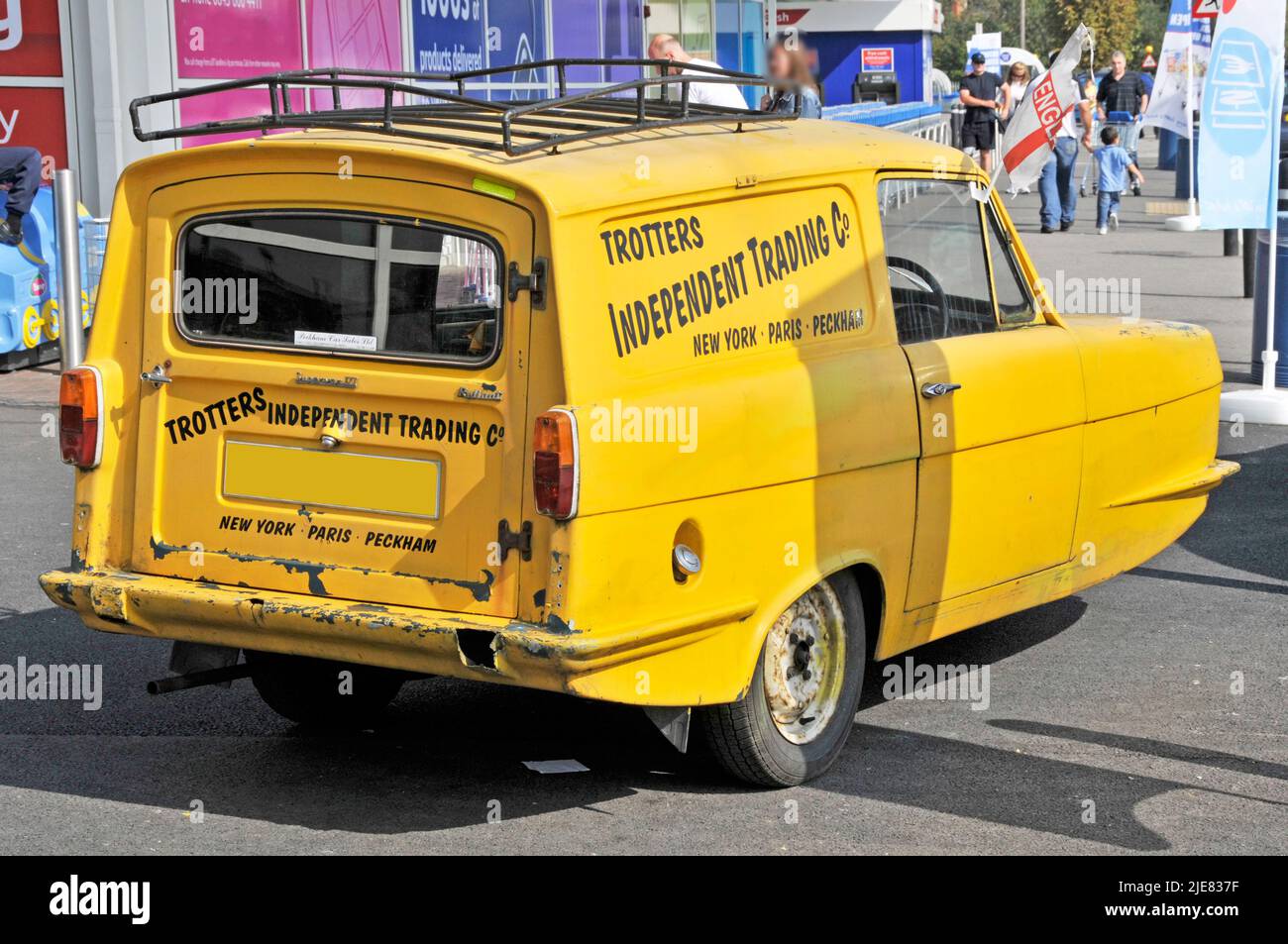 Trotters clean yellow Reliant Regal Supervan also referred to as Reliant Robin in Only Fools and Horses TV show parked Romford Market East London UK Stock Photo