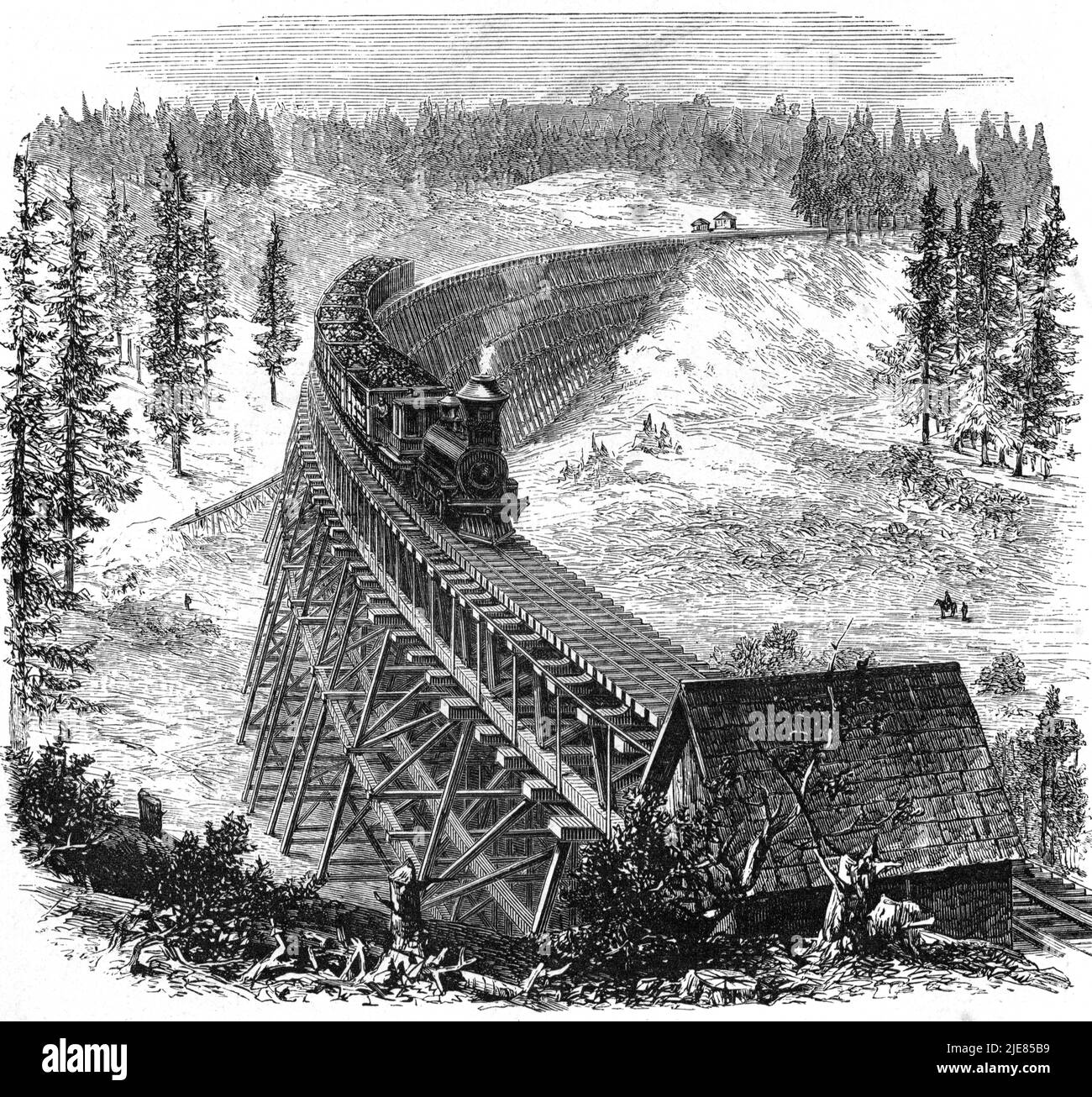 Steam Train travelling across Trestle bridge on the Pacific railway Stock Photo