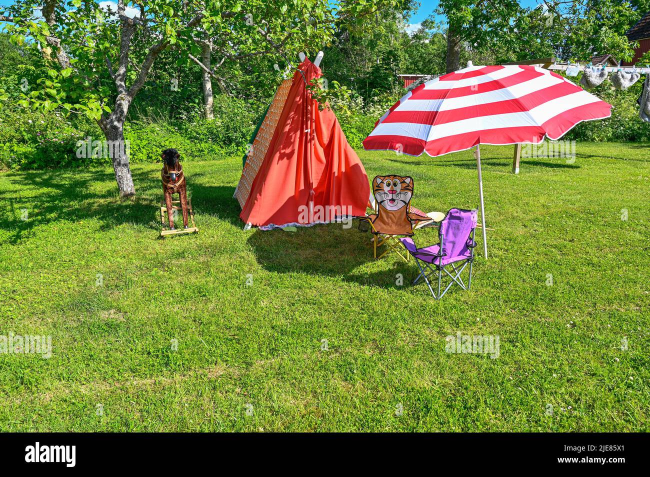 toys for child on lawn in back garden Stock Photo - Alamy