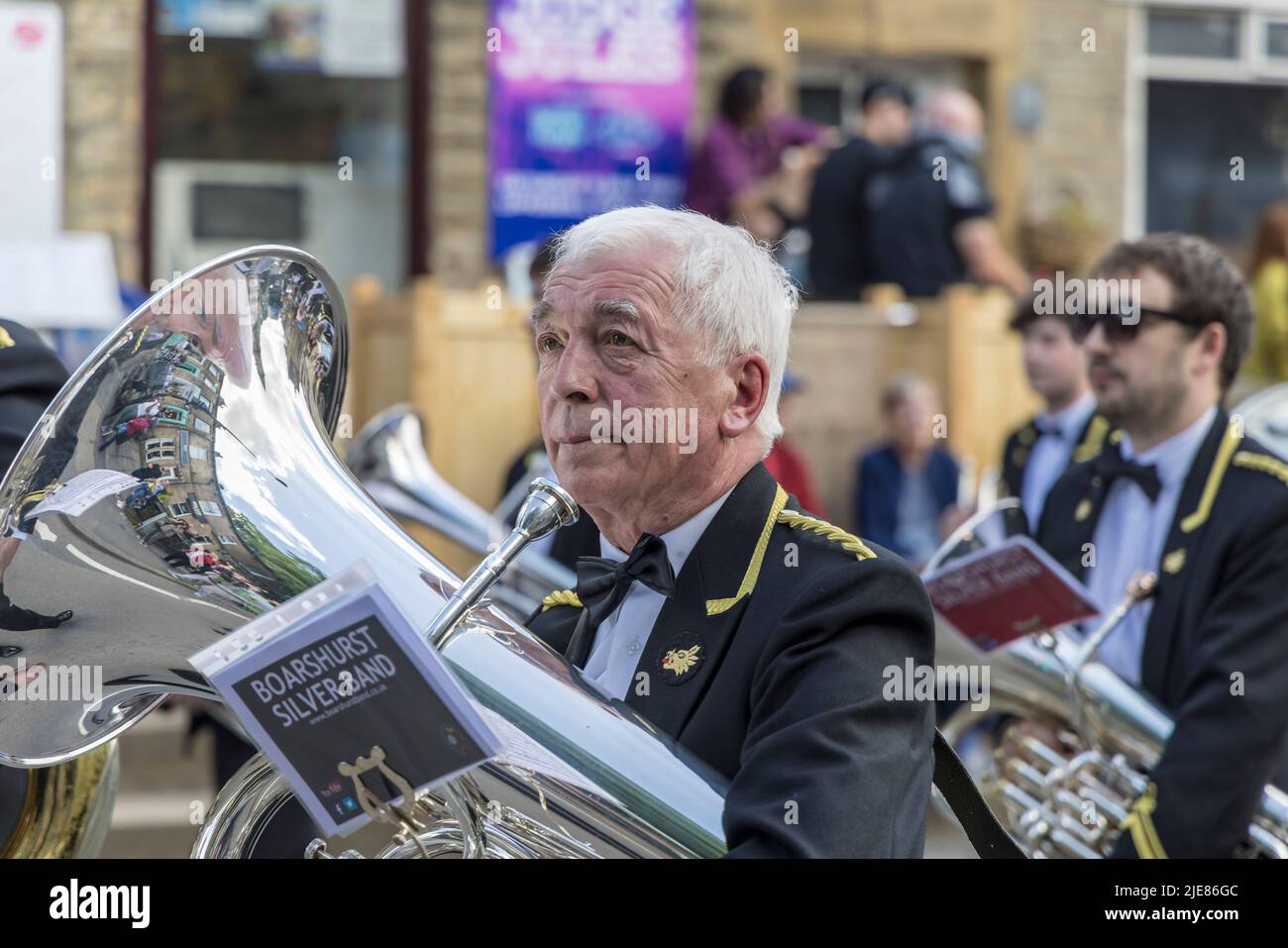 Senior musician participant with tuba on the street at the Uppermill Brass Band Whit Friday Contest, England. Stock Photo
