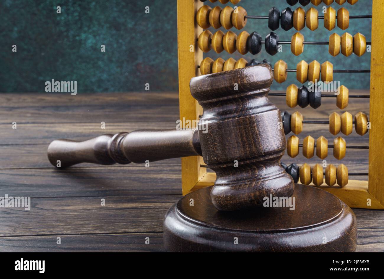 Judge gavel with abacus on table. Accounting violations concept Stock Photo