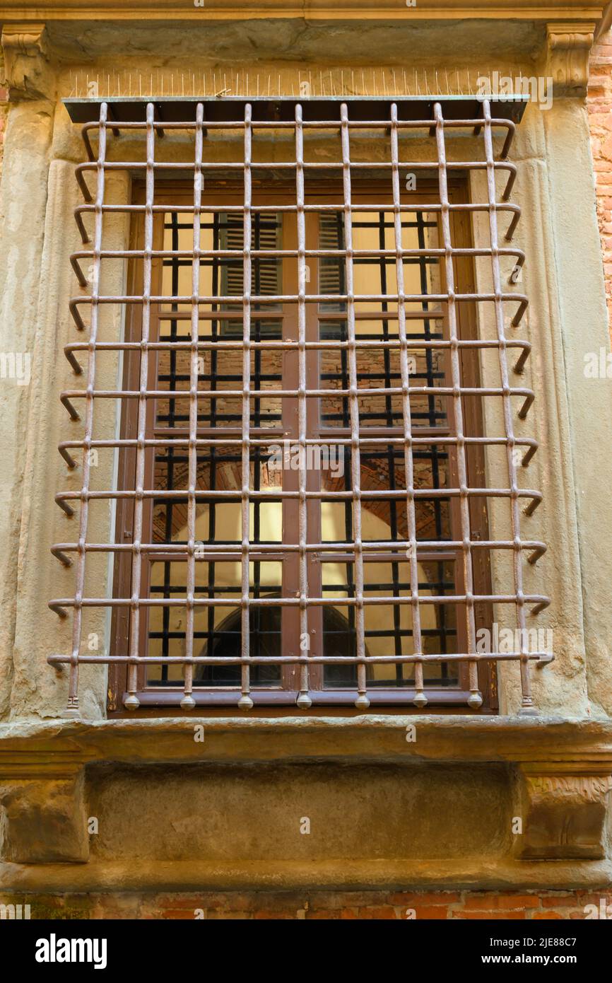 Characteristic protective grating on a historic building in Lucca Stock Photo