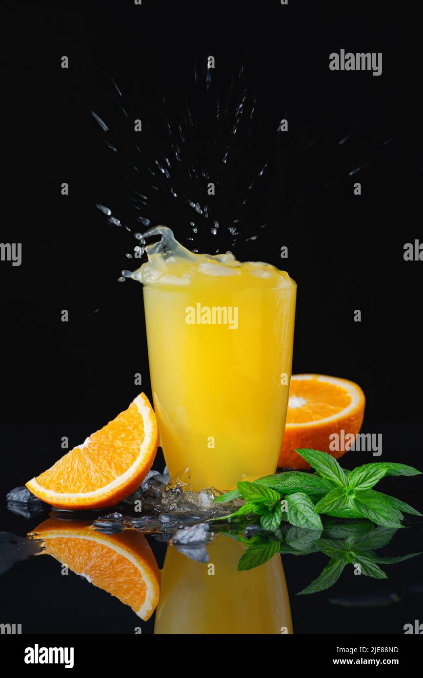 Orange ice drink with splash Stock Photo Alamy