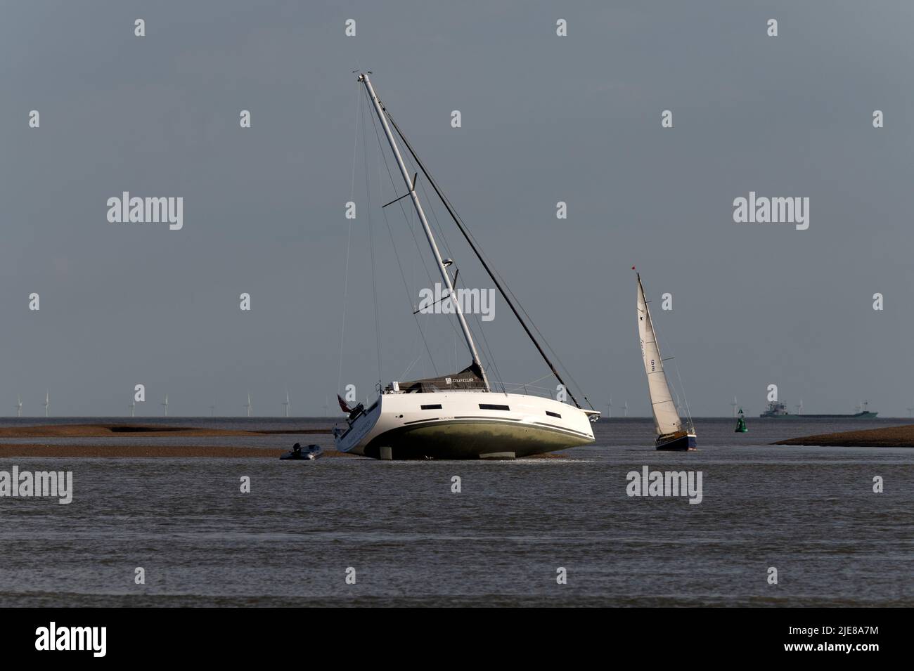 Yacht aground river Deben estuary Bawdsey Ferry Suffolk Stock Photo