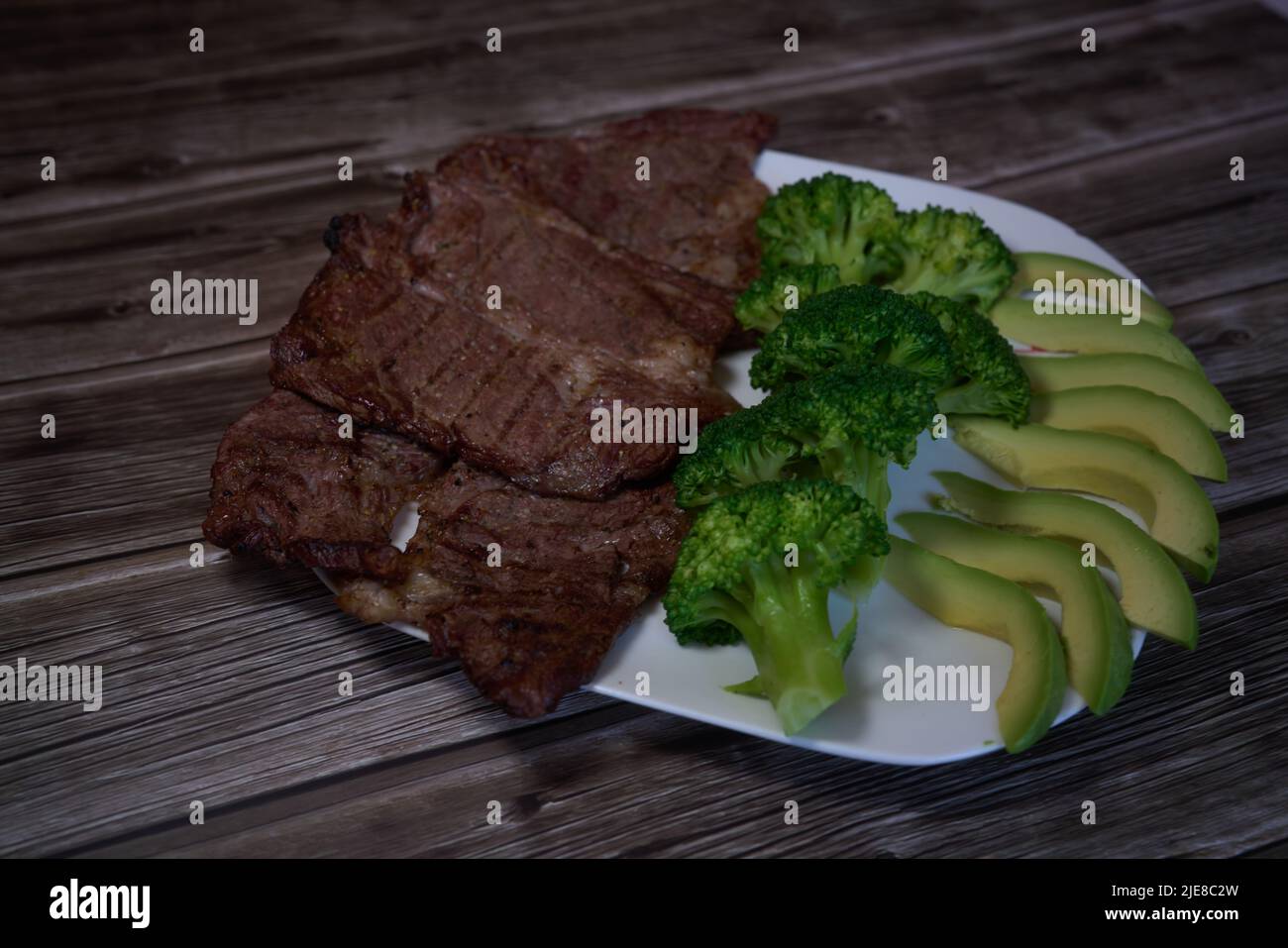 Keto diet based on beef steak, broccoli and avocado. High quality photo Stock Photo