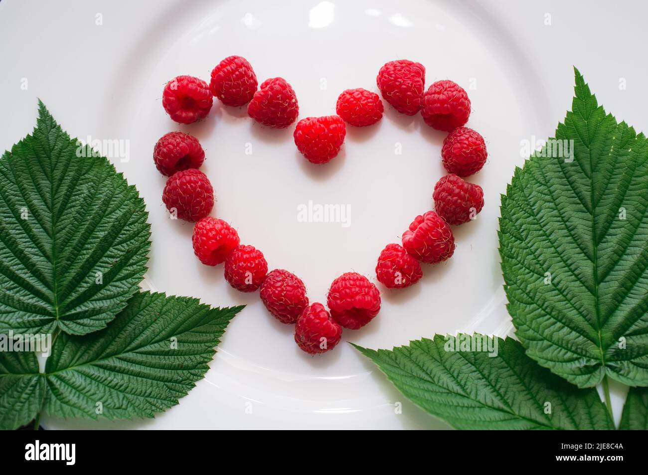 Raspberry in shape heart hi-res stock photography and images - Alamy