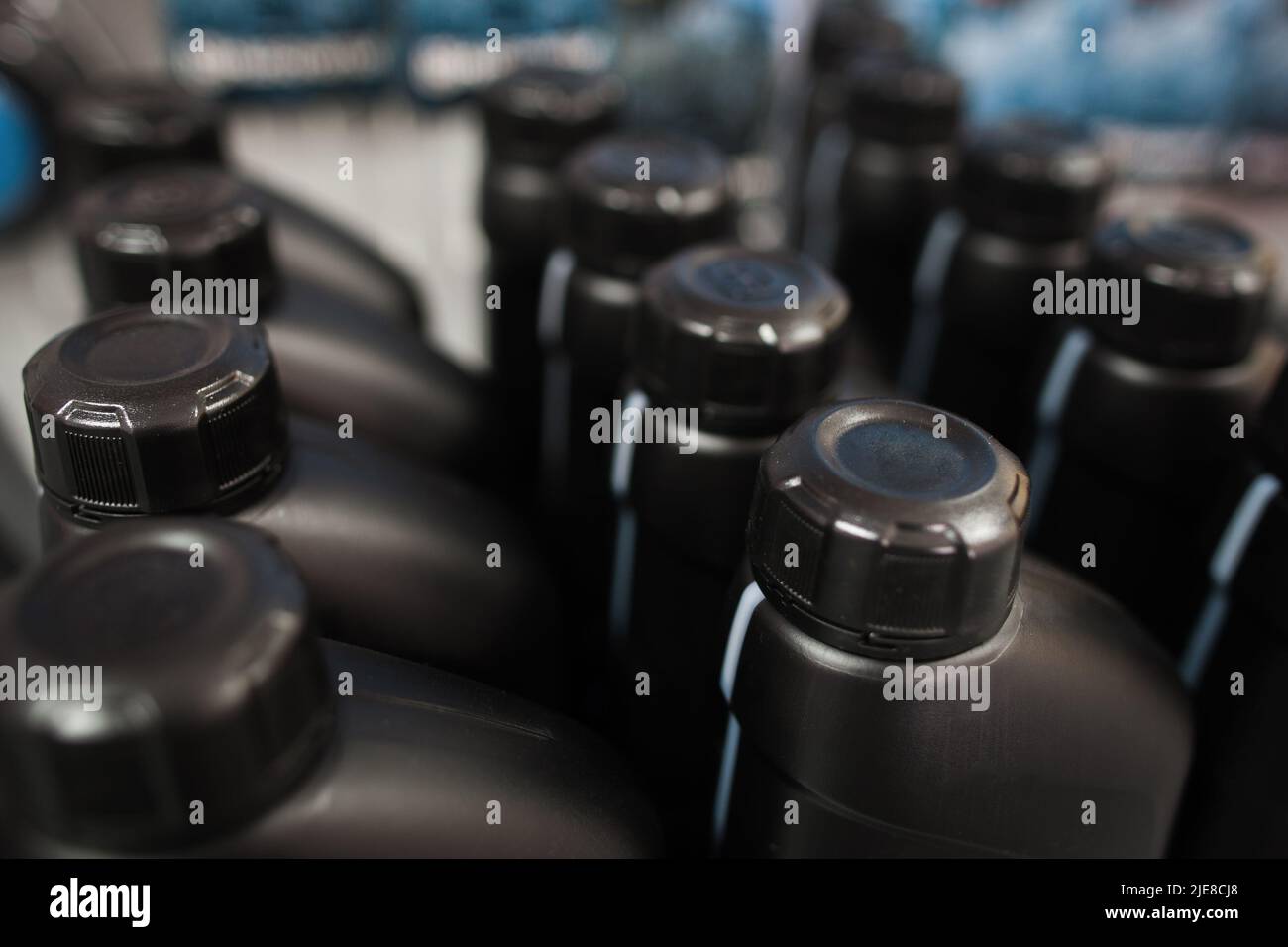 Motor oil in plastic bottle. Store showcases Stock Photo Alamy