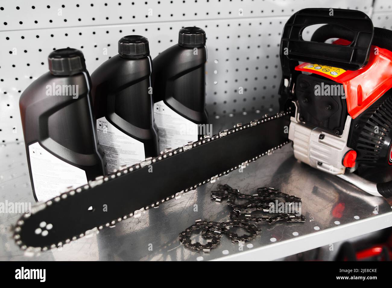 Chainsaw, oil bottle display on tool store Stock Photo Alamy