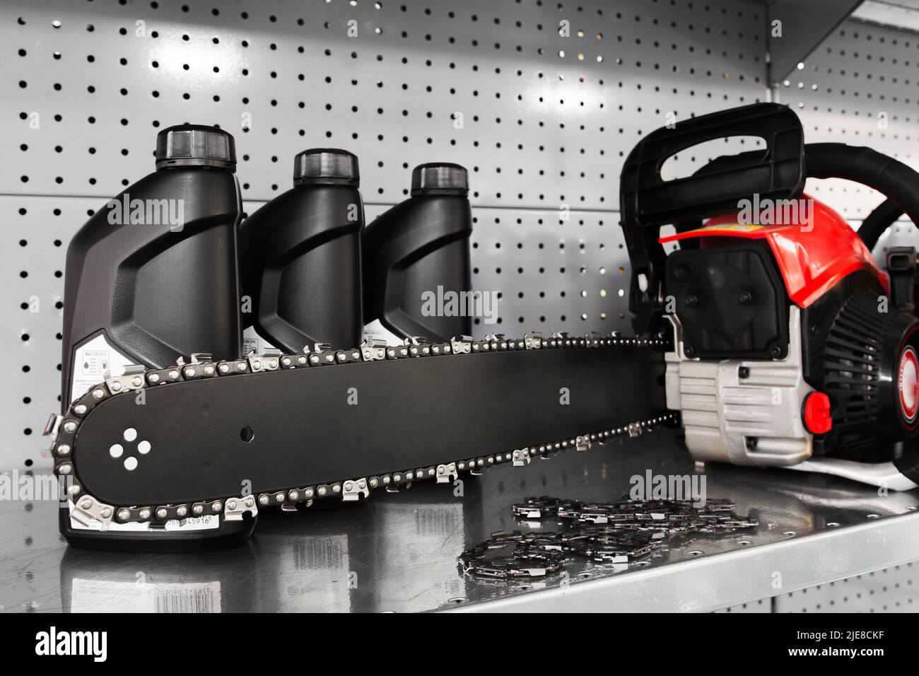 Chainsaw, oil bottle display on tool store Stock Photo Alamy