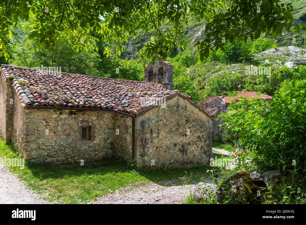 View of the church, hermitage, with its bell tower in the town of Bulnes. Stock Photo