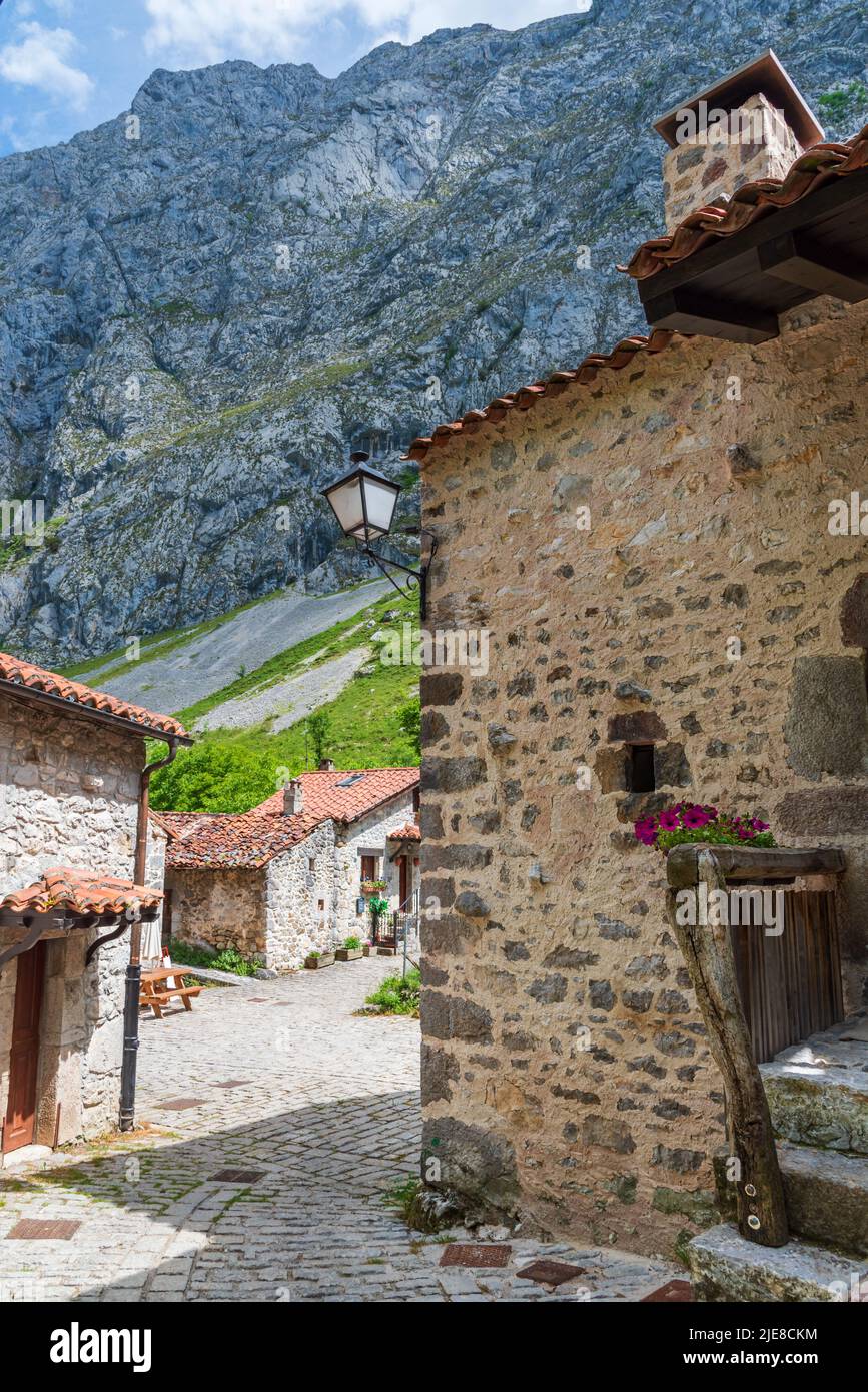 Street with stone houses in the town of Bulnes, located in the Picos de Europa. Stock Photo
