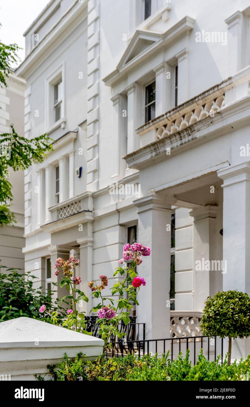 Landsdown Road, residential street with pastelcolor houses in Notting Hill area, west London