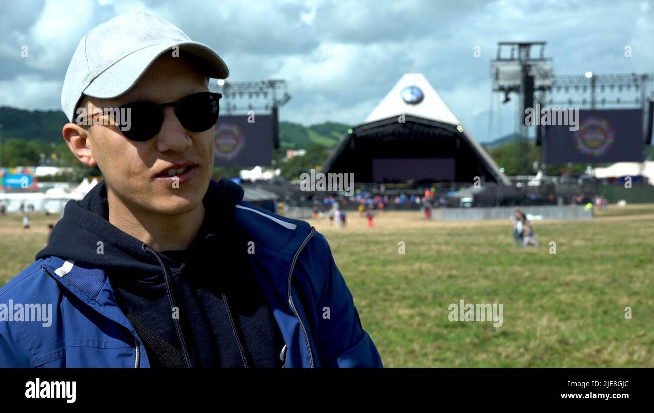 Screengrab taken from PA Video of member of The Citizens of the World Refugee Choir Aref Hussaini, 23, from Afghanistan. The refugee choir representing more than 30 countries are set to perform at the Glastonbury Festival. Picture date: Saturday June 25, 2022. Stock Photo