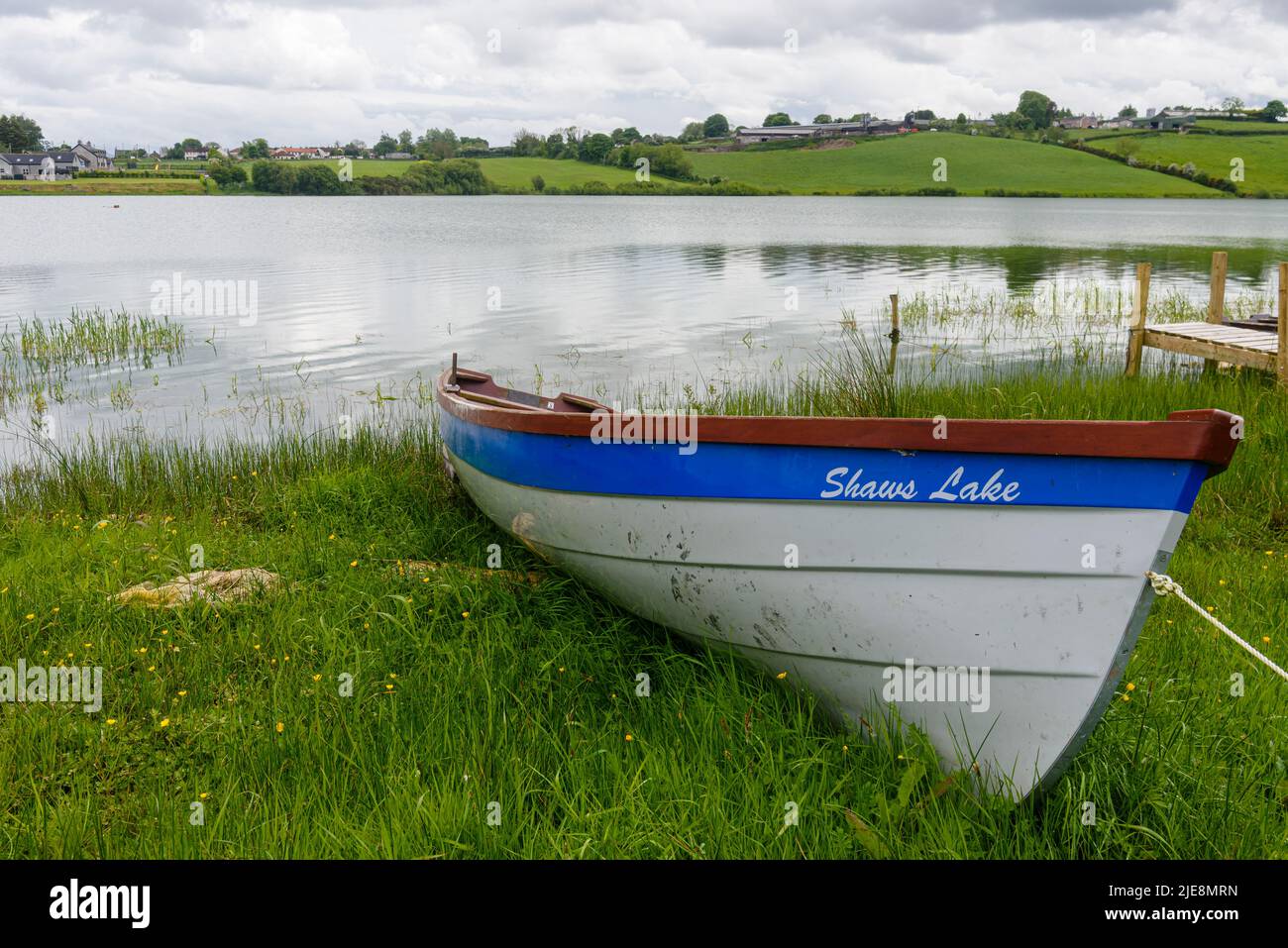 Rowing boat moored up at a lake Stock Photo