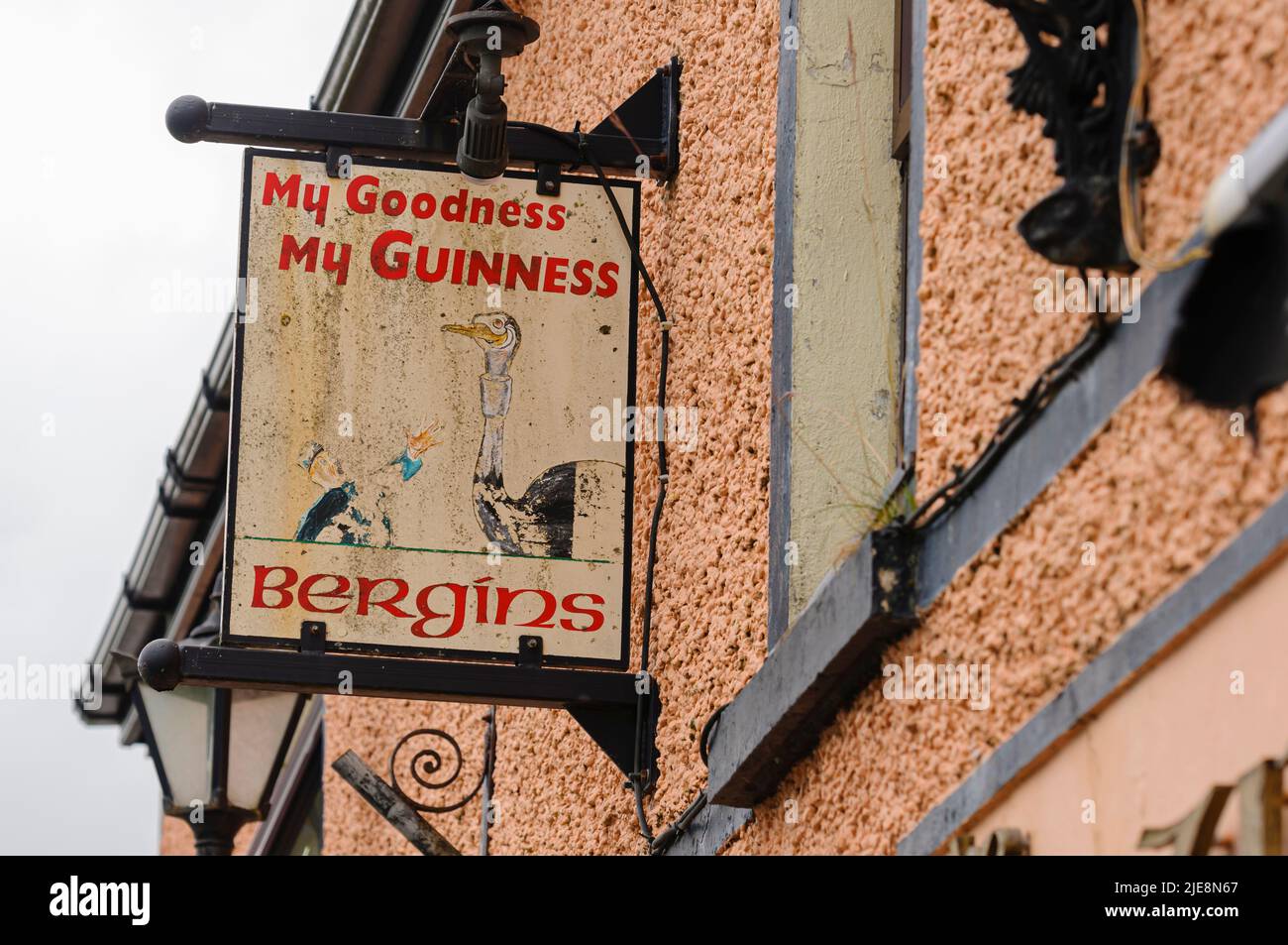 Very old Guinness sign outside an Irish pub with the slogan 'My goodness, My Guinness' Stock Photo