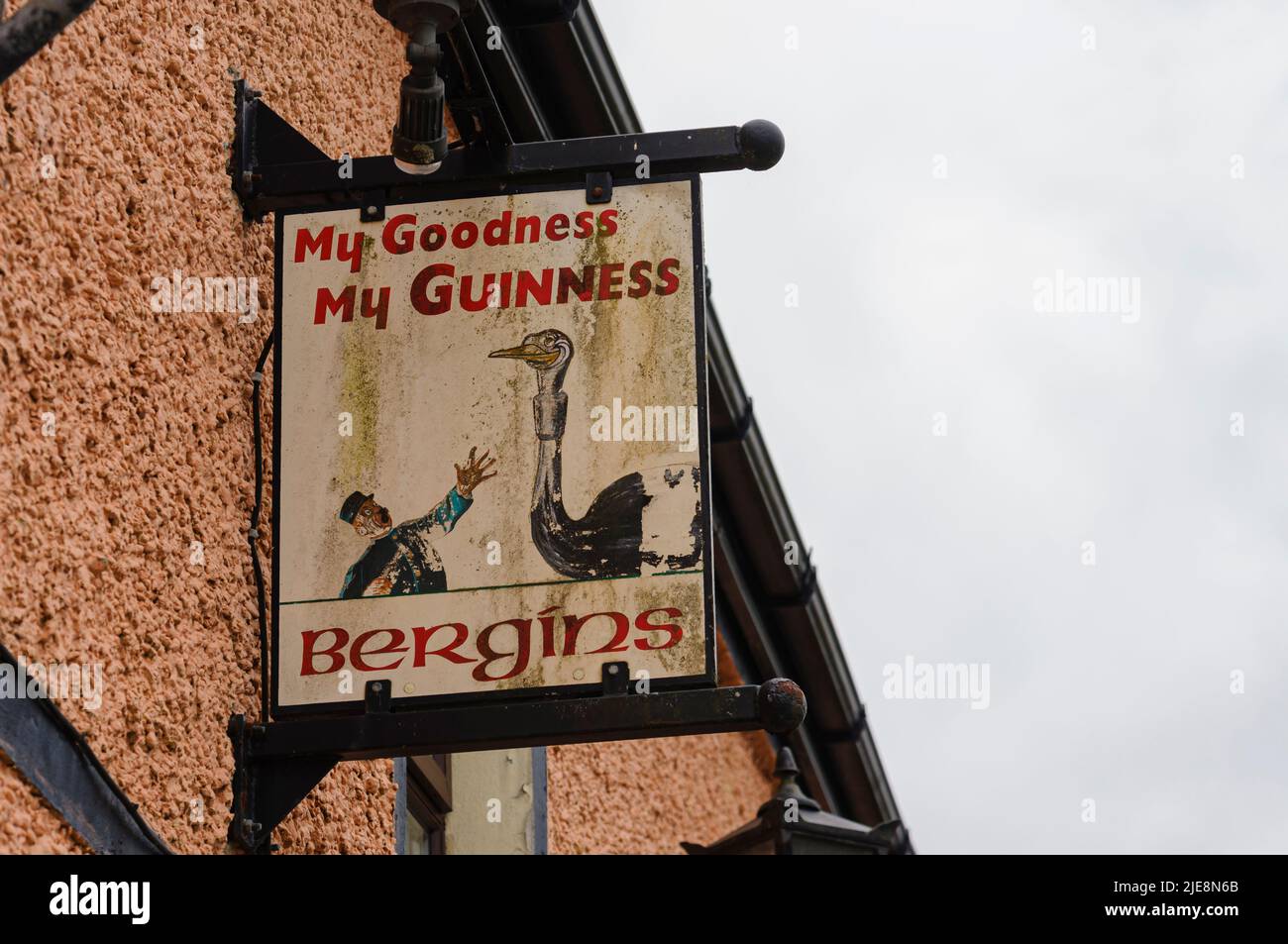Very old Guinness sign outside an Irish pub with the slogan 'My goodness, My Guinness' Stock Photo