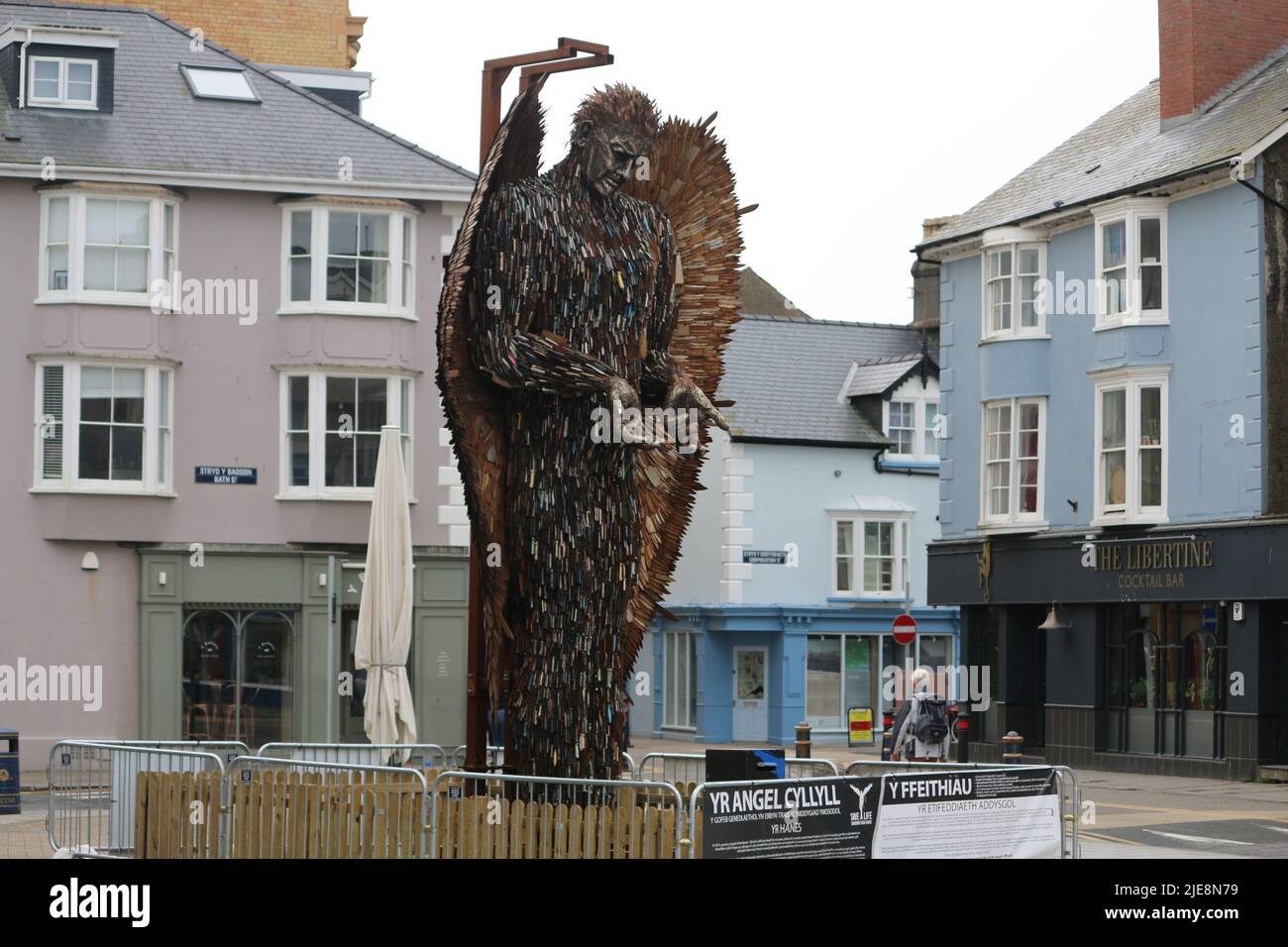 The Knife Angel in Aberystwyth Wales, UK. 26th June, 2022. during a nation wide tour. The statue stands 27 feet tall made by artist Alfie Bradley from 100,000 knives and blades that have been confiscated by UK police forces . The angel is designed to impress the negative effects of violent behaviour . The next few days the statue will be moved to its next stage on the Wirral, Merseyside . Credit: mike davies/Alamy Live News Stock Photo