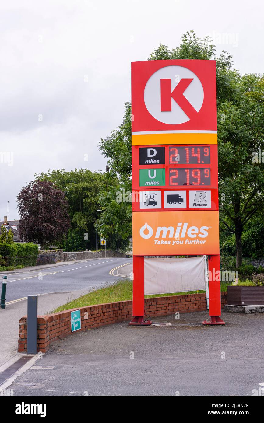 Price board outside a petrol station, showing high priced expensive petrol and diesel over £2 €2 per litre liter Stock Photo