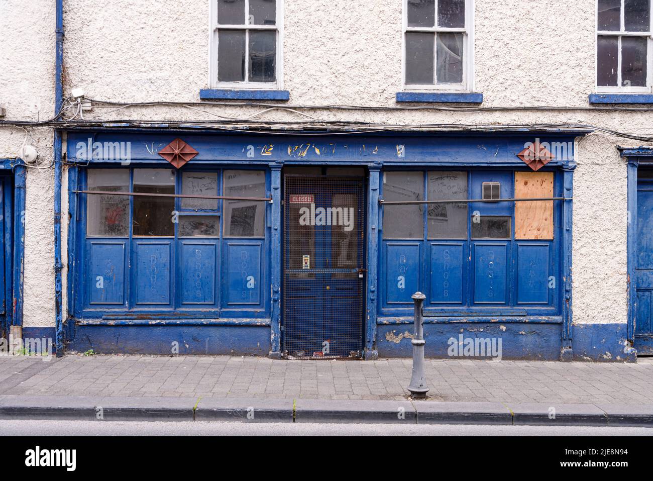 Irish pub that has gone out of business and is closed down. Stock Photo