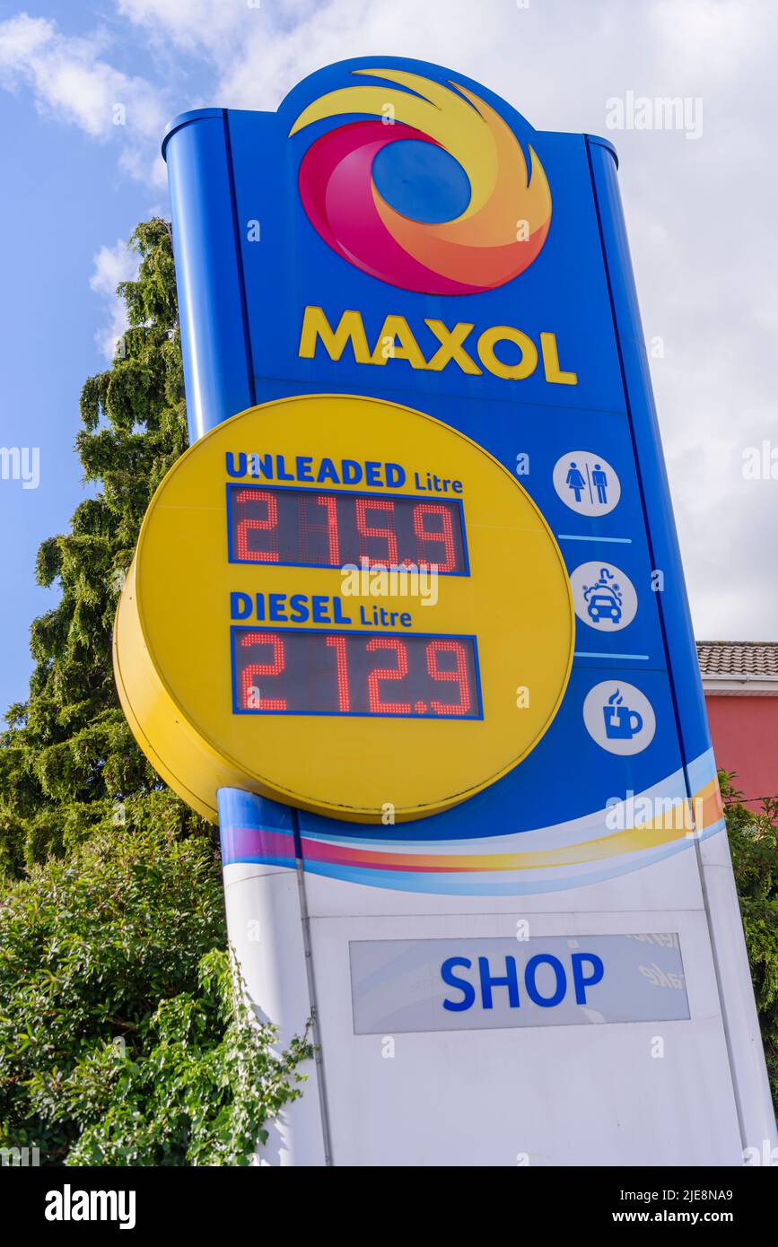 Price board outside a petrol station, showing high priced expensive petrol and diesel over £2 €2 per litre liter Stock Photo