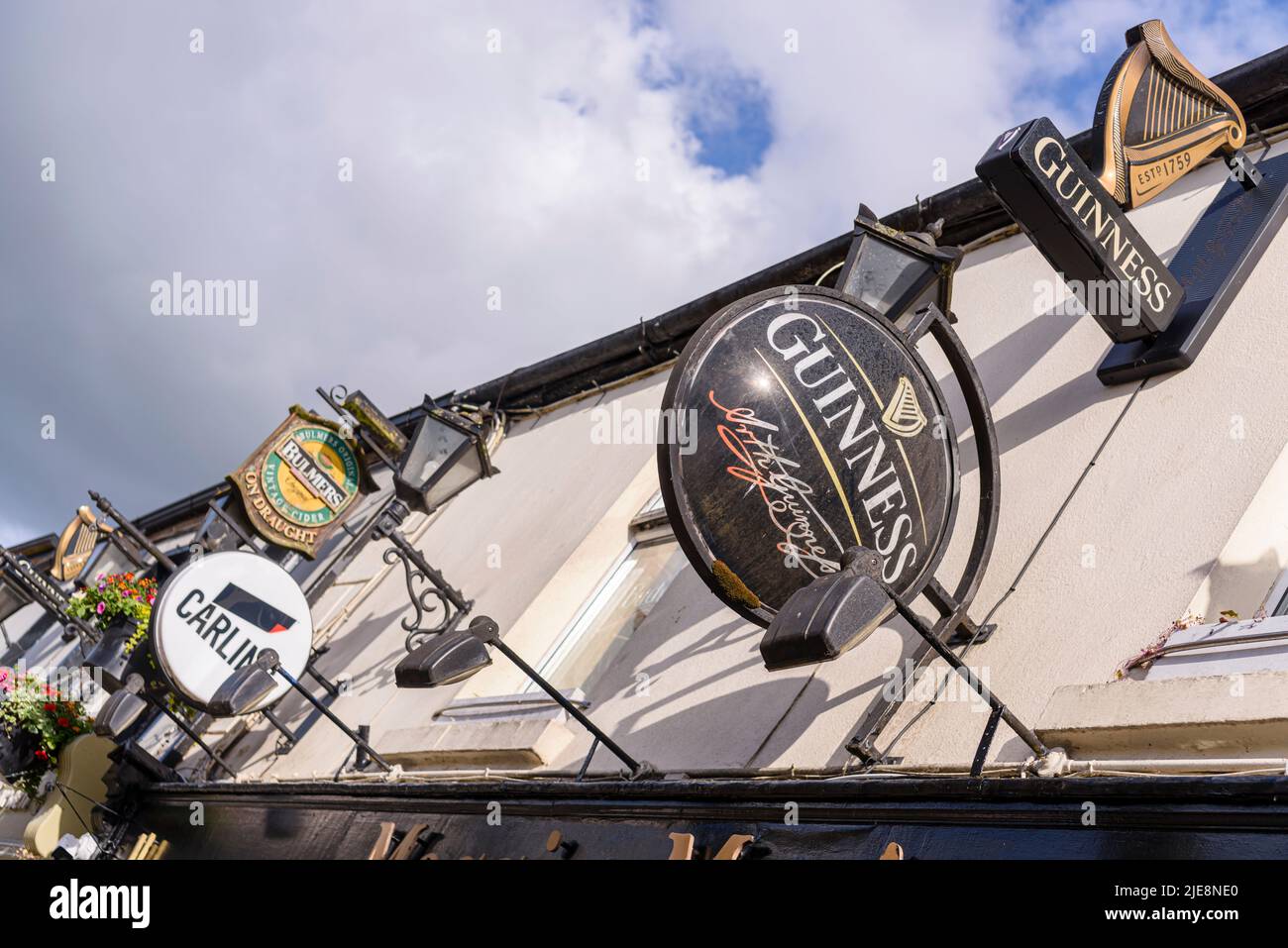 Signs for Guinness, Carling and Bulmers outside an Irish pub. Stock Photo