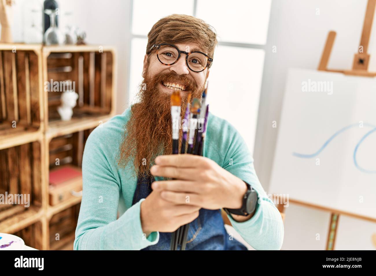 Smiling redhead man painting hi-res stock photography and images - Alamy