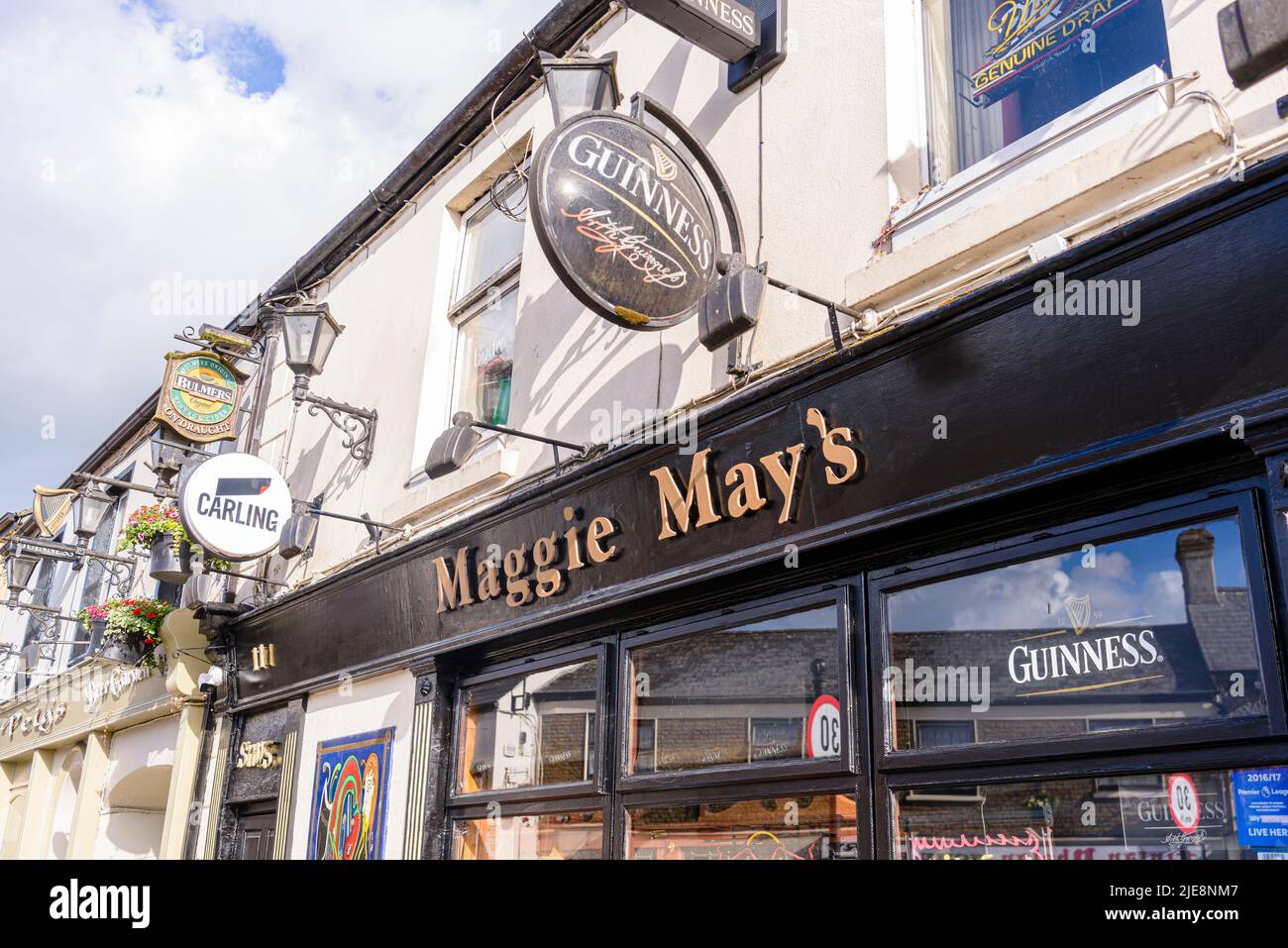 Signs for Guinness, Carling and Bulmers outside an Irish pub. Stock Photo