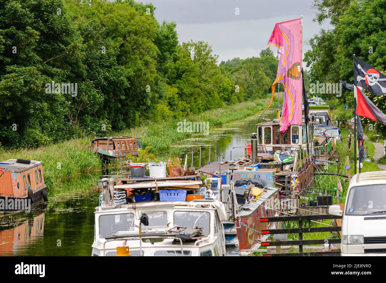 Canalboats houseboats on a canal in County Laoise, Republic of Ireland Stock Photo