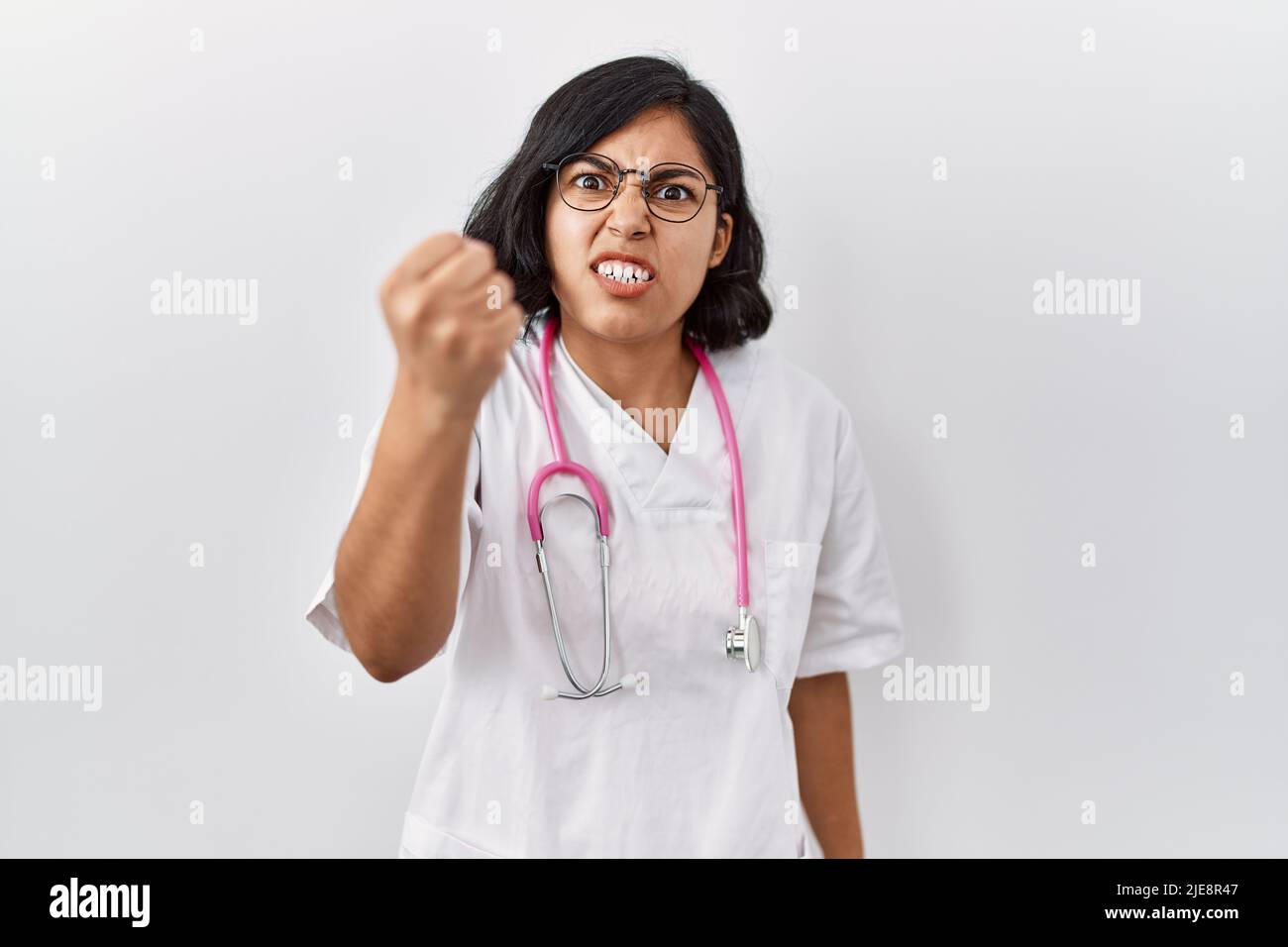 Young hispanic doctor woman wearing stethoscope over isolated