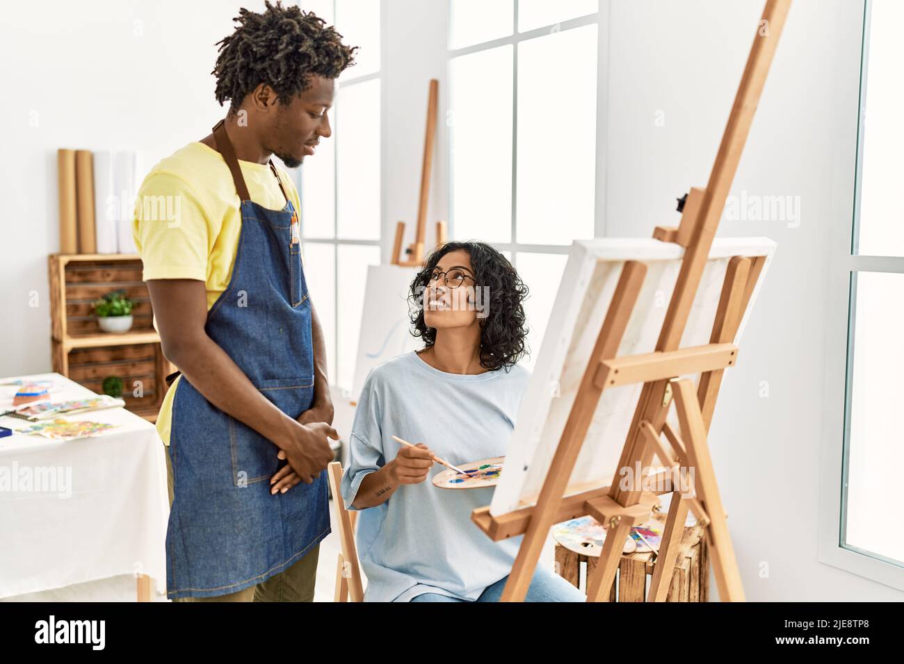 Artist teacher and student painting at art studio Stock Photo Alamy