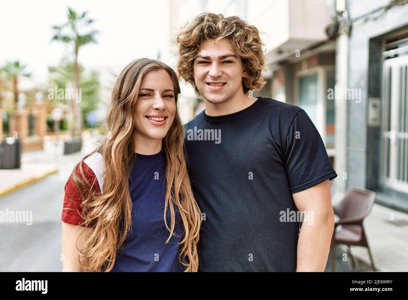 Young caucasian couple smiling happy and hugging at the city Stock ...