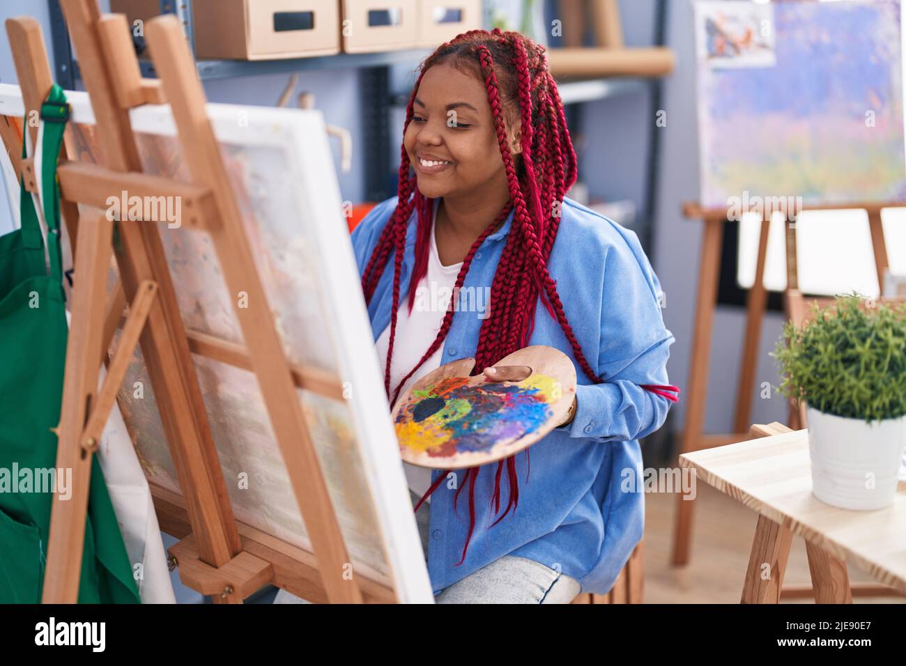 African american woman artist smiling confident drawing at art studio ...