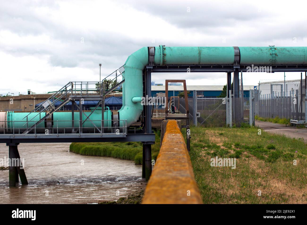 Overhead sewage treatment pipes beside the River Thames, Beckton Sewage Treatment Works in, Newham, East London - England 2021 Stock Photo