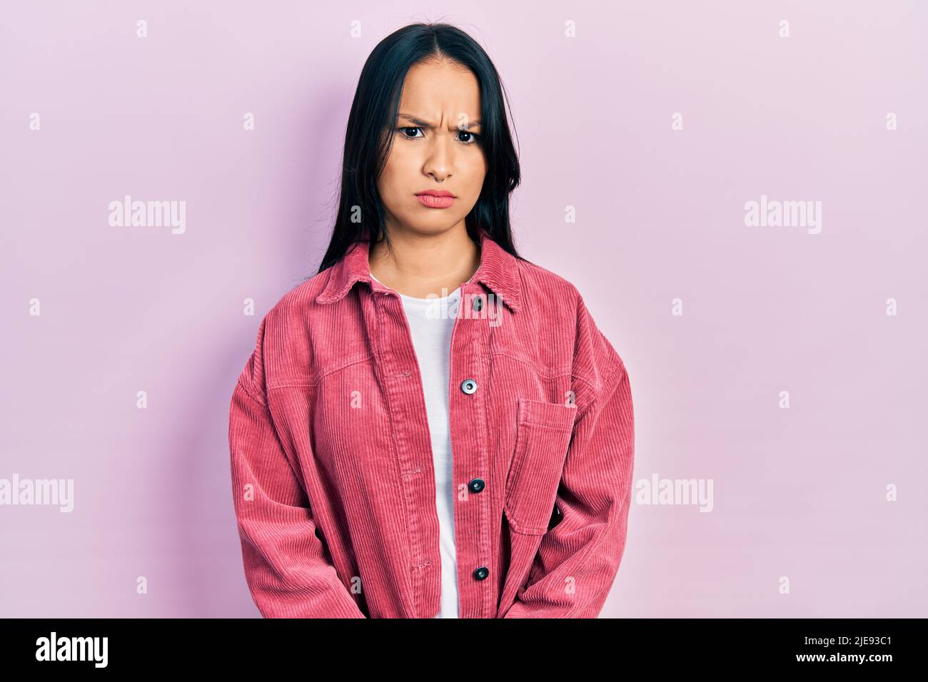 Beautiful hispanic woman with nose piercing wearing casual pink jacket skeptic and nervous, frowning upset because of problem. negative person Stock Photo - Alamy Beautiful hispanic woman with nose piercing wearing casual pink jacket skeptic and nervous, frowning upset because of problem. negative person Stock Photo - Alamy
