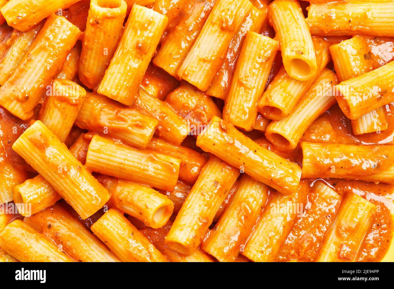 Delicious italian rigatoni pasta with tomato sauce texture Stock Photo