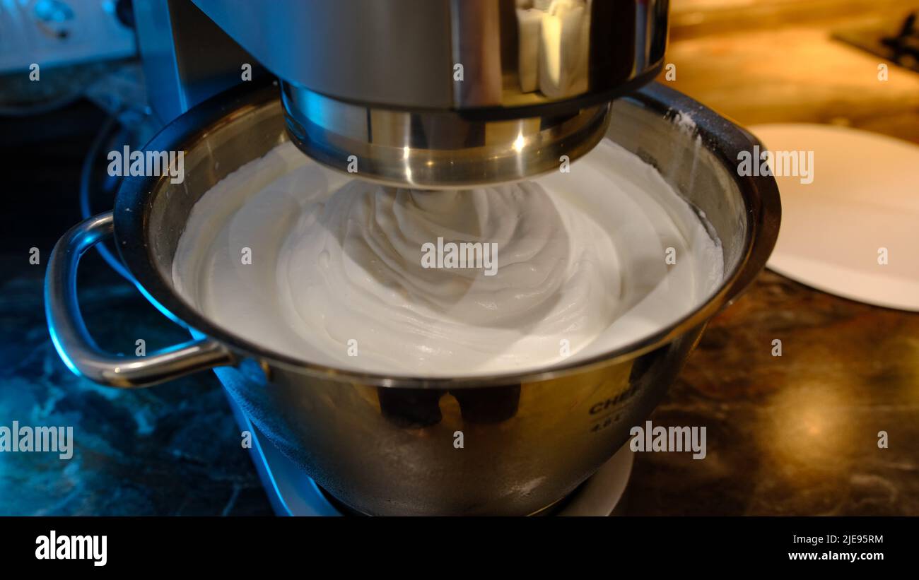 Beaten egg cream whites until frothy. Whipped egg whites for a meringue