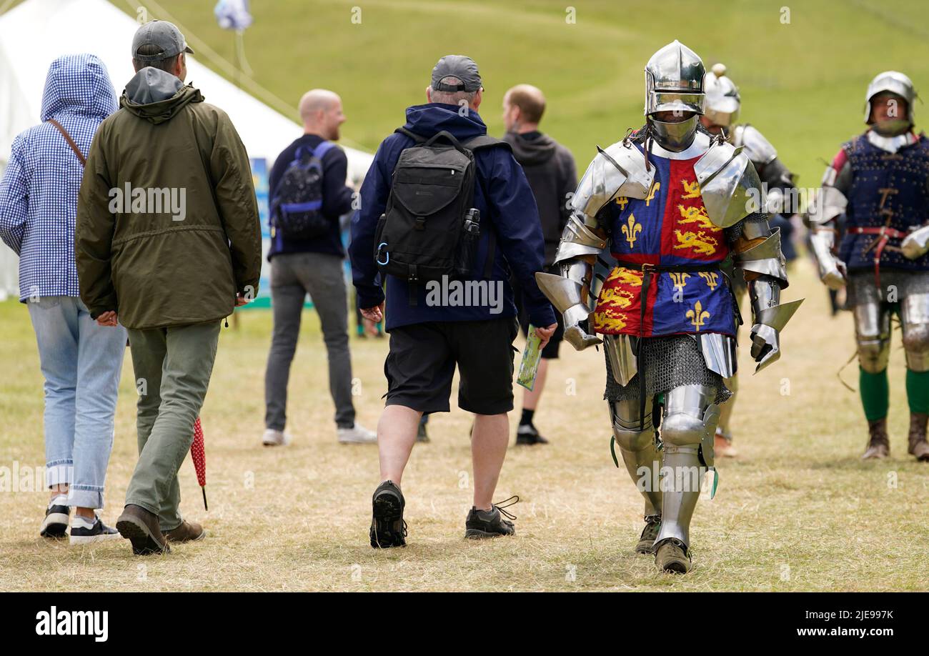 A War of the Roses era re-enactor playing the role of King Richard III walks through the festival site during the Chalke Valley History festival at Broad Chalke, Near Salisbury, Wiltshire. Picture date: Sunday June 26, 2022. Stock Photo