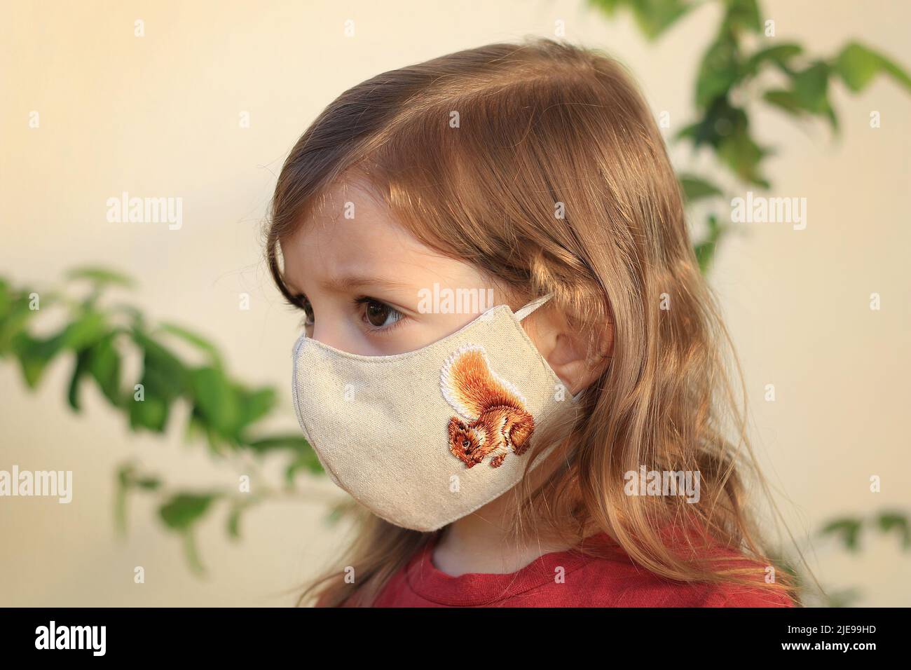Toddler wearing a face mask during the Covid19 pandemic Stock Photo