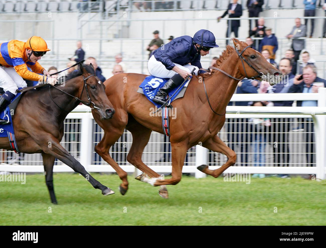 Statuette (right) ridden by jockey Ryan Moore on their way to winning the Airlie Stud Stakes during day three of the Dubai Duty Free Irish Derby Festival at Curragh Racecourse in County Kildare, Ireland. Picture date: Sunday June 26, 2022. Stock Photo