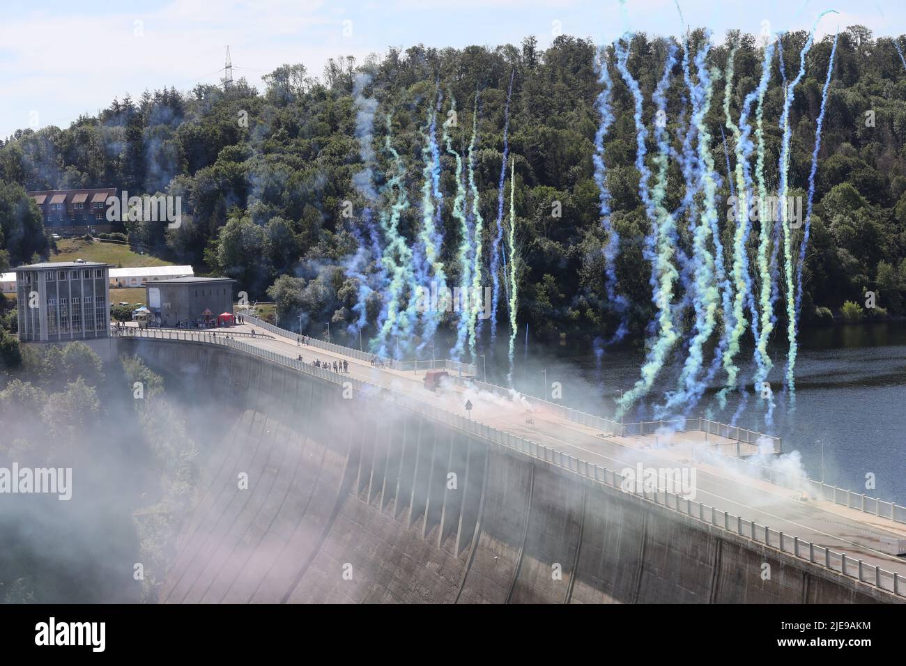 Hasselfelde, Germany. 26th June, 2022. The 10th anniversary of the Megazipline at the Rappbode Dam was celebrated with a fireworks display on the 109-meter-high dam wall. The operators have organized a colorful family festival. Credit: Matthias Bein/dpa/Alamy Live News Stock Photo