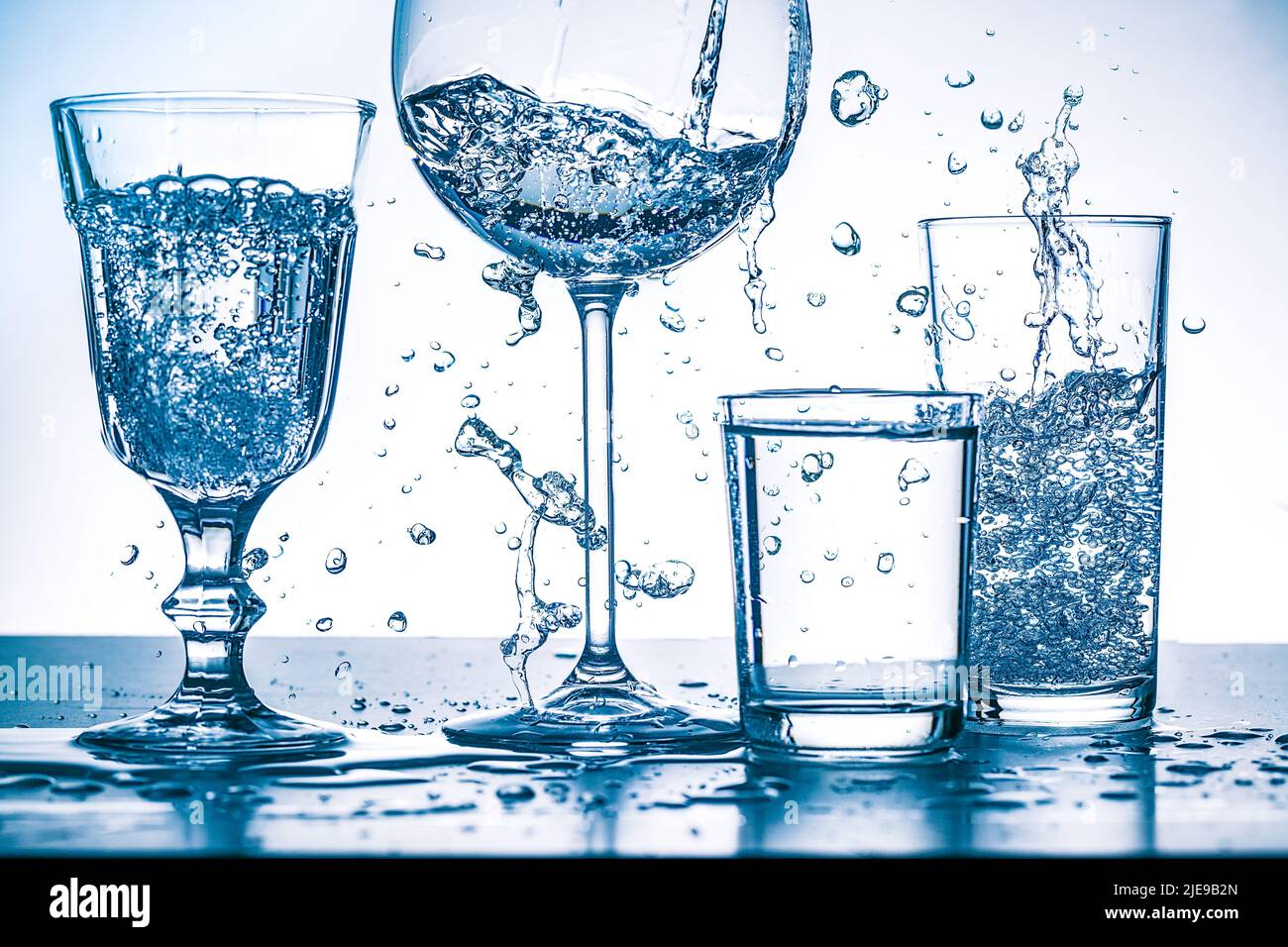 Fresh, strongly agitated water in glasses Stock Photo