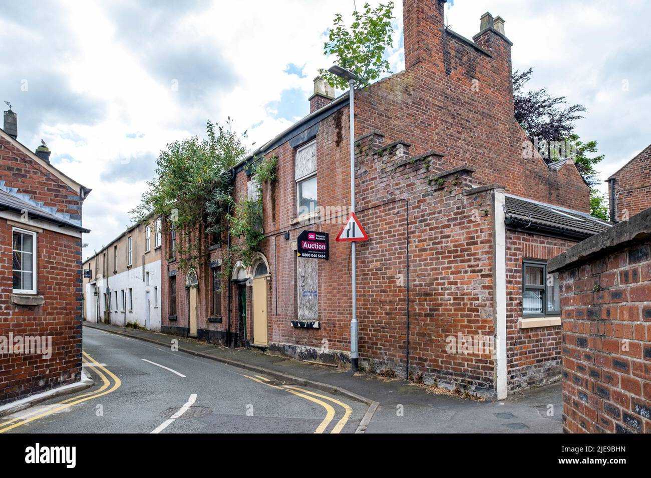 Derelict houses in town centre of Congleton Cheshire UK Stock Photo