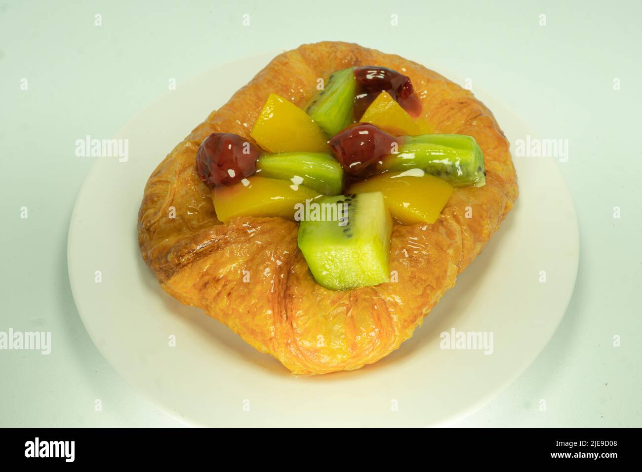 Closed up of Danish pastry with fruits isolated on white background Stock Photo