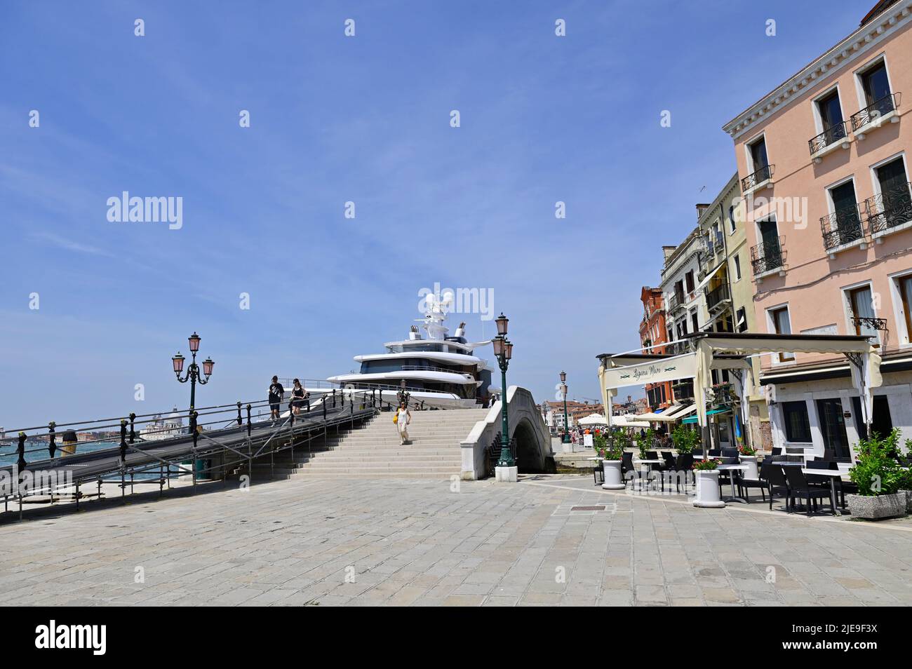 Venice, Italy. June 17, 2022. Waterfront promenade Riva degli Schiavoni in Venice. Artifact yacht in Venice port Stock Photo