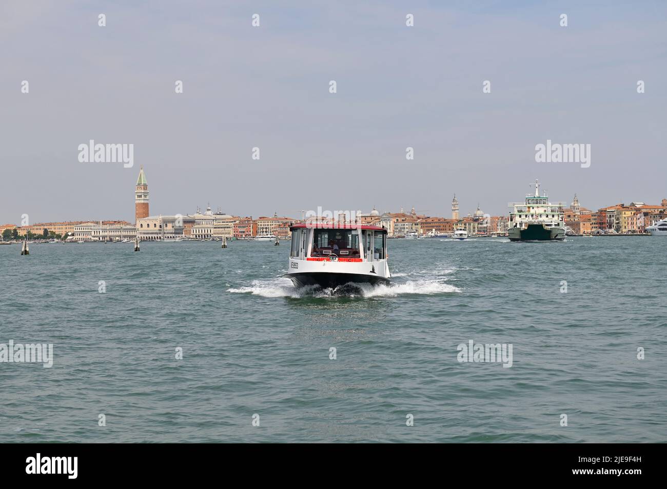 Venice, Italy. June 17, 2022. Entrance to the Venice Lagoon. Water taxi and ferry in the background Stock Photo