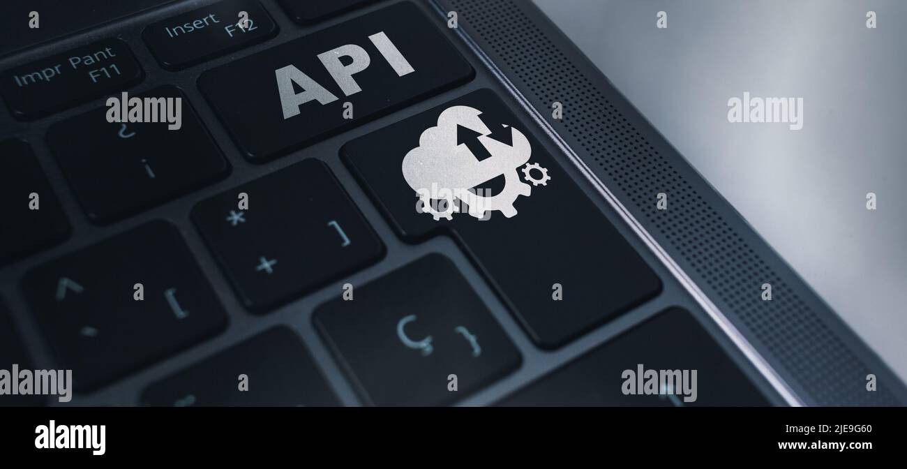 Banner of laptop keyboard with API acronym word icon concept. Application Programming Interface. Software Development. Stock Photo