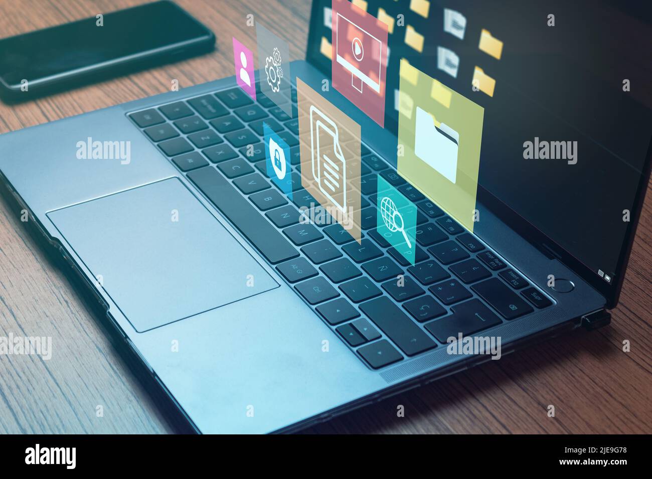 Laptop with management document icons for data management system concept. Documentation database and digital file storage system software. Stock Photo