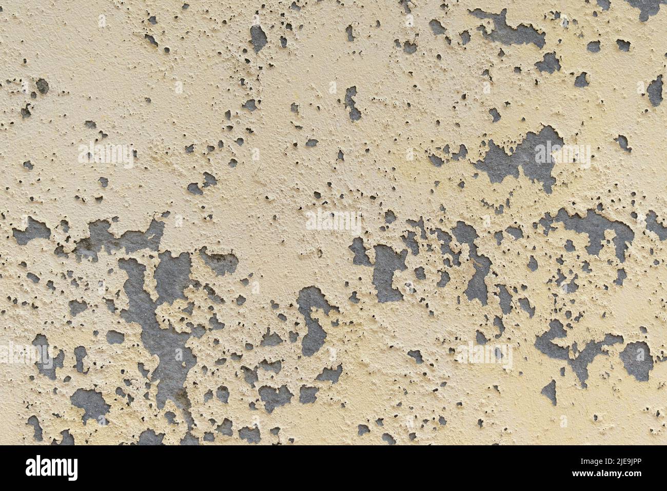 Grungy rough textured wall. Peeled structure. Abstract background Stock Photo