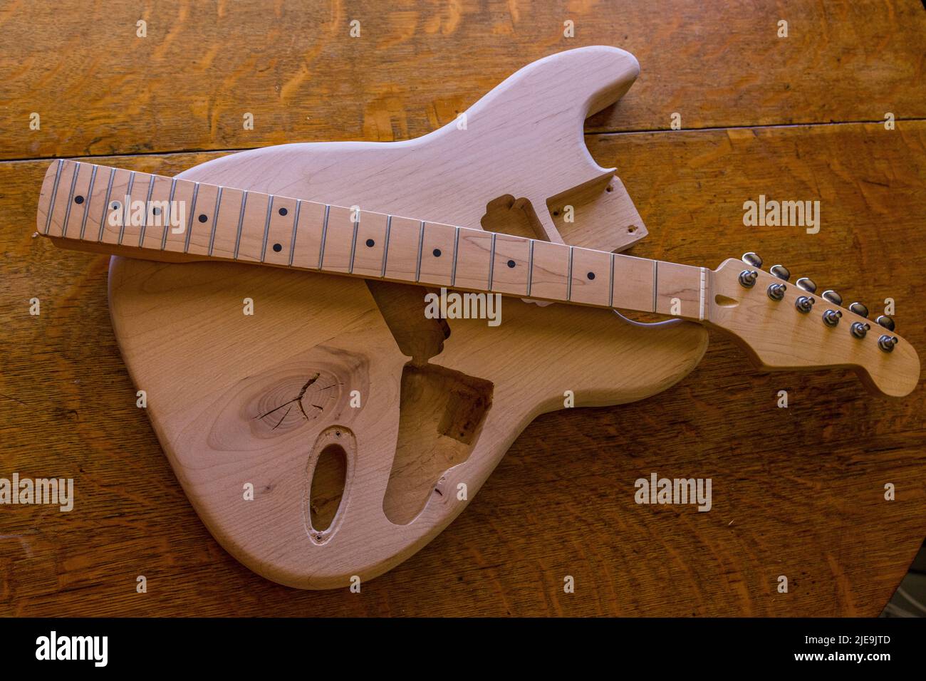 An electric stratocaster style guitar that is under construction Stock Photo