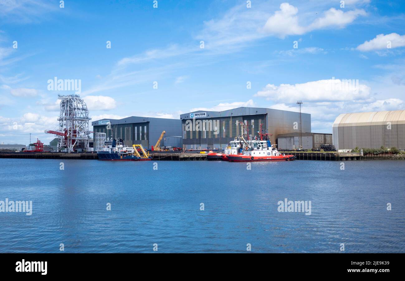 The quayside at Wilton Group fabrication yard with a white painted underwater structure under construction  at  Port Clarnce on the River Tees Stock Photo